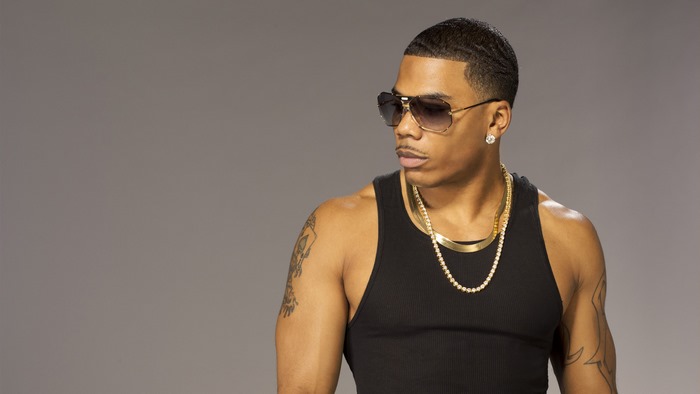 Nelly in black tank top and sunglasses
