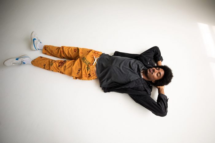 Tai Verdes lying on white floor