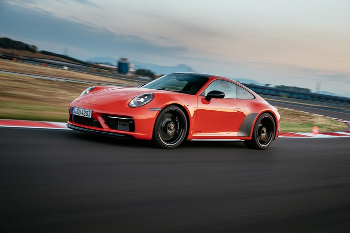 Red Porsche 911 Carrera GTS on race track