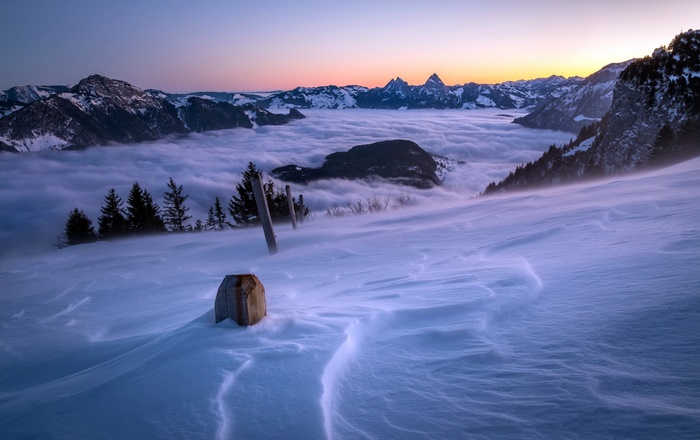 Snowy Mountain Landscape Above a Sea of Clouds