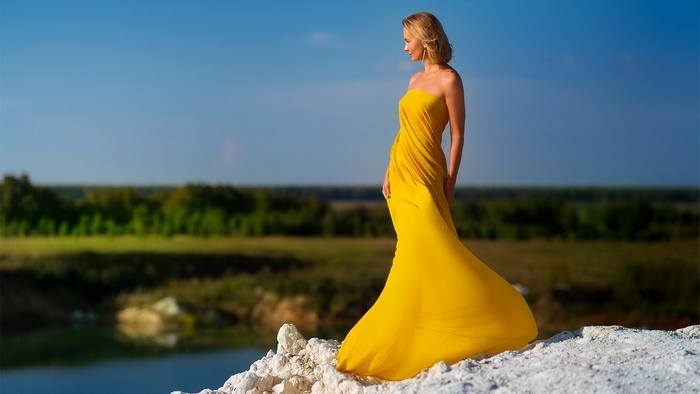 Model in Yellow Dress Overlooking Landscape