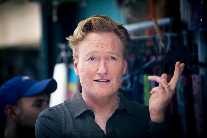 Conan O'Brien looking up and gesturing