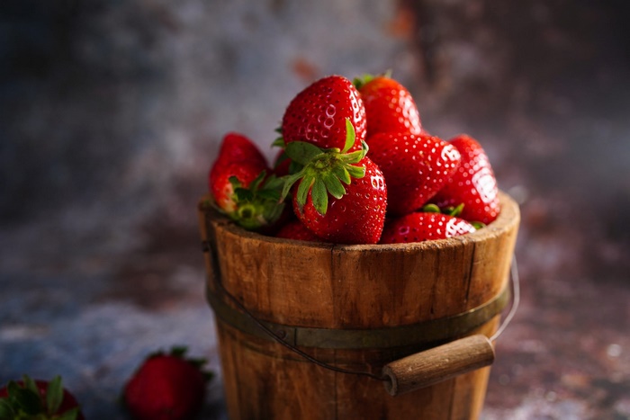 Fresh Strawberries in Rustic Wooden Bucket