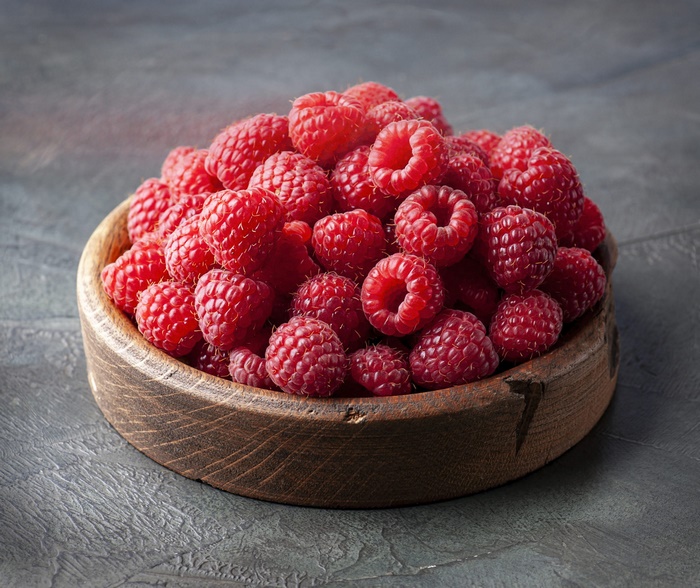 Fresh Raspberries in Wooden Bowl