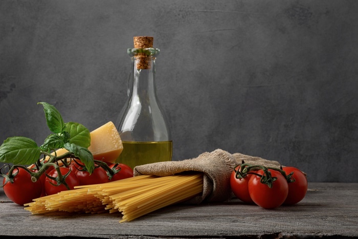 Still Life of Spaghetti, Tomatoes, and Italian Pasta Ingredients