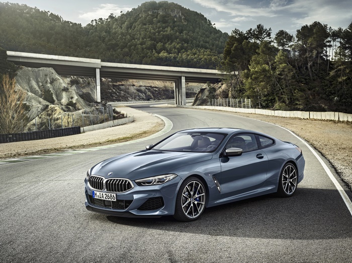 Blue BMW M850i Luxury Car on Winding Road 4K