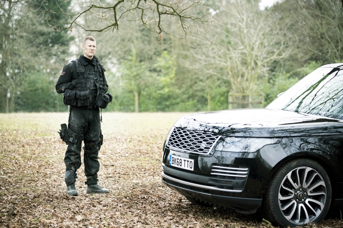 Tom Hopper in SAS: Red Notice with Range Rover