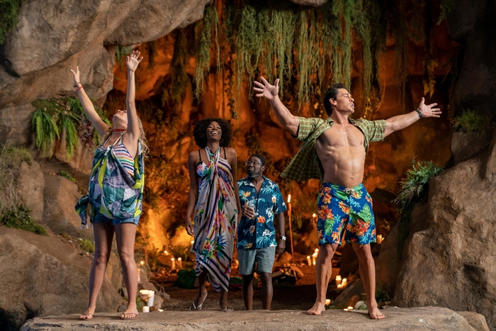 Vacation Friends cast celebrating in a grotto