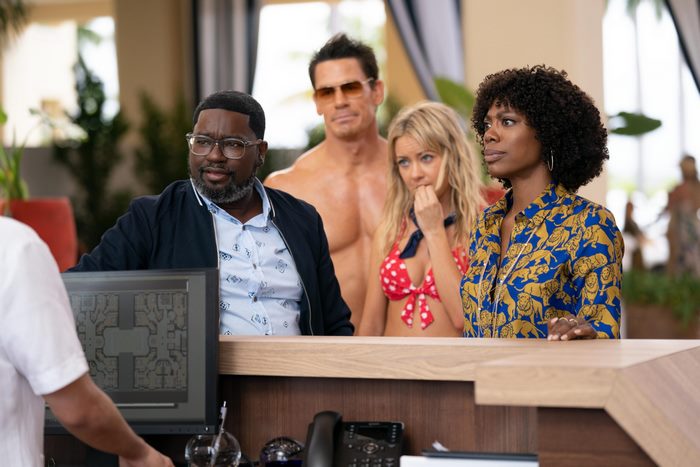Vacation Friends cast at hotel reception desk