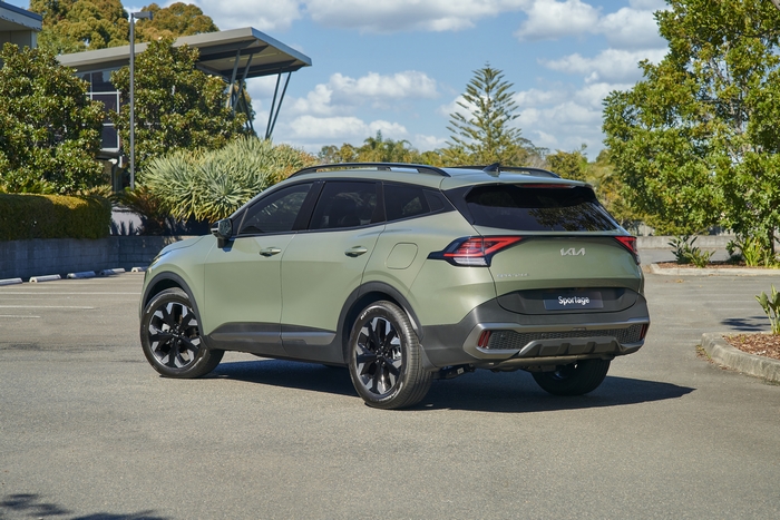 Green Kia Sportage SUV parked outdoors