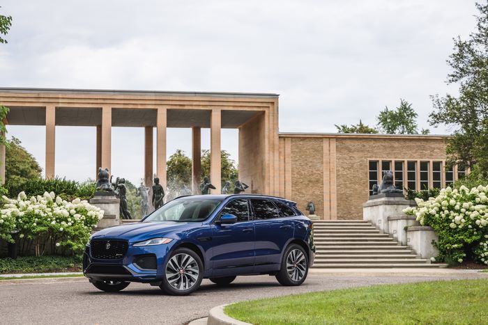 Blue Jaguar F-Pace SUV at a classical building