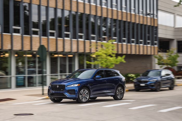 Blue Jaguar F-Pace P400 R-Dynamic SUV driving on street