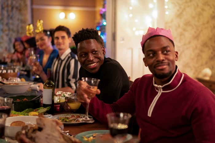 Ted Lasso: Sam and Isaac celebrating at dinner