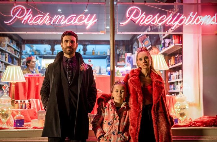 Brett Goldstein and Juno Temple at a neon pharmacy