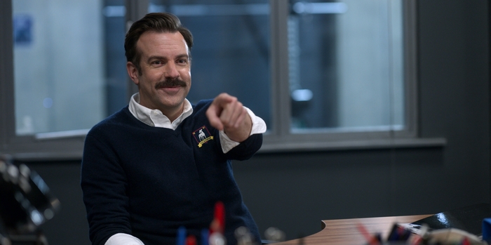 Ted Lasso smiling and pointing