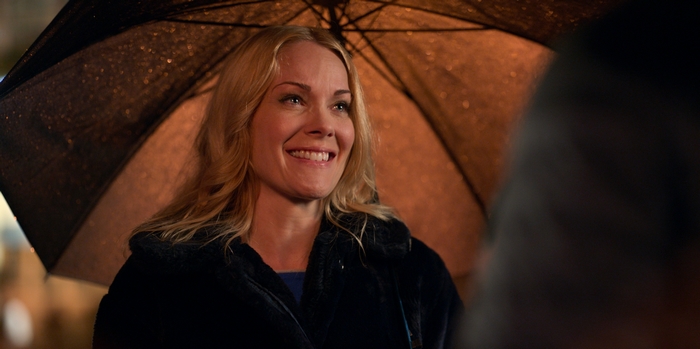 Hannah Waddingham smiling under umbrella in Ted Lasso