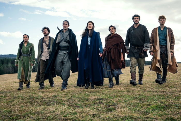 The Wheel of Time cast walking in a field