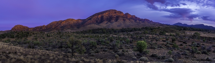 Golden Peaks and Purple Sky over Mountain Landscape