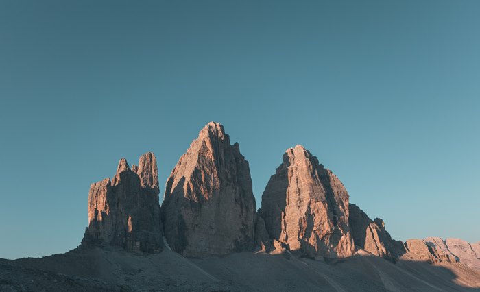Tre Cime Di Lavaredo rocky peaks at sunrise