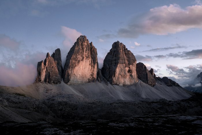 Tre Cime Di Lavaredo mountains with pink clouds