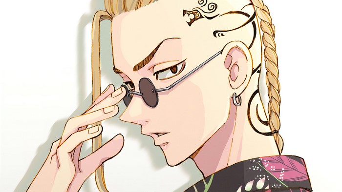 Ken Ryuguji adjusting his round sunglasses