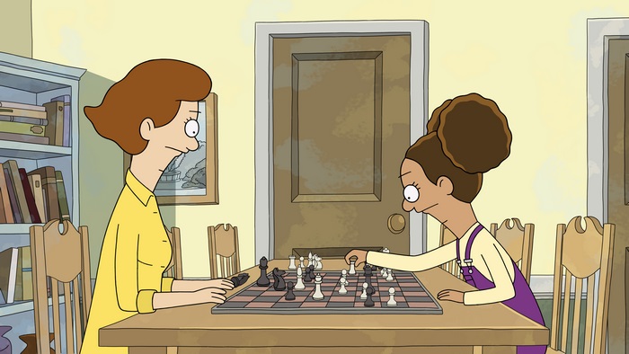 Molly and Paige playing chess in Central Park