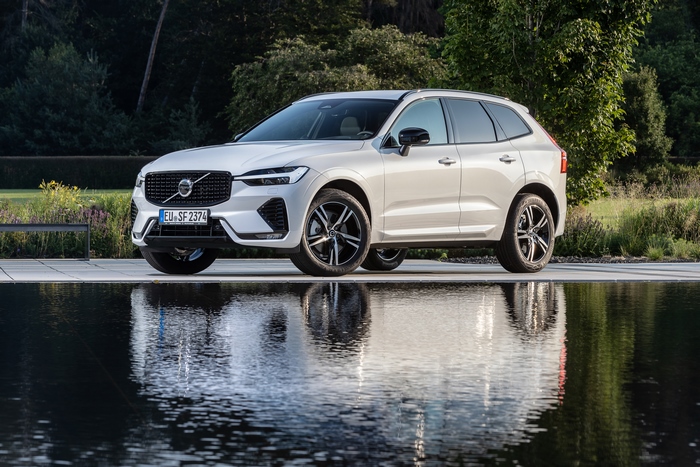 Luxury White Volvo XC60 SUV with water reflection
