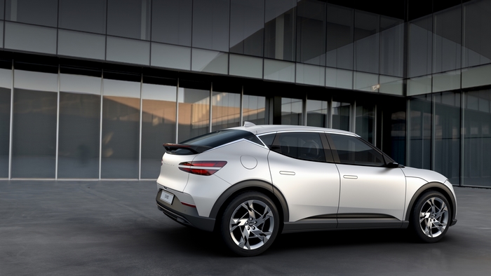 Genesis GV60 SUV parked outside modern building