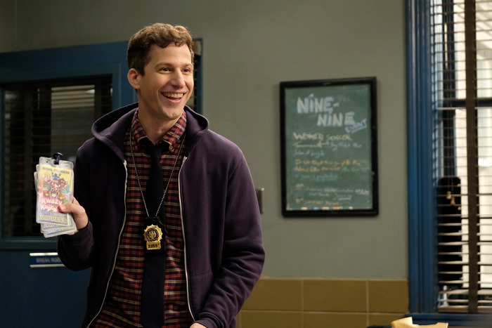 Andy Samberg as Jake Peralta smiling in Brooklyn Nine-Nine