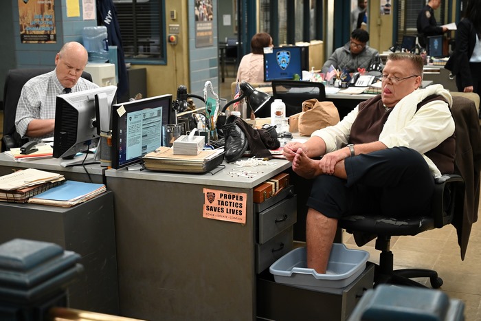 Scully soaking feet at his desk in Brooklyn Nine-Nine