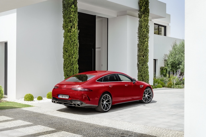 Red Mercedes-AMG GT 63 S E Performance at modern house