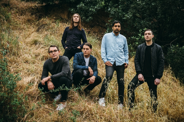 Deafheaven band members posing outdoors