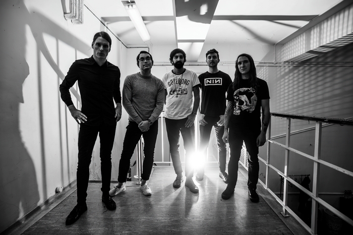 Deafheaven band portrait in a hallway