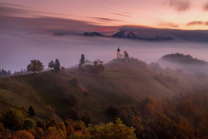 Church of Saints Primus and Felician at Misty Sunrise