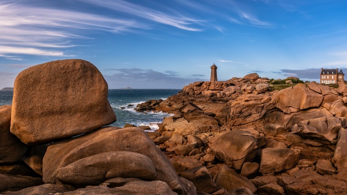 Lighthouse and House on Rocky Coastline in France