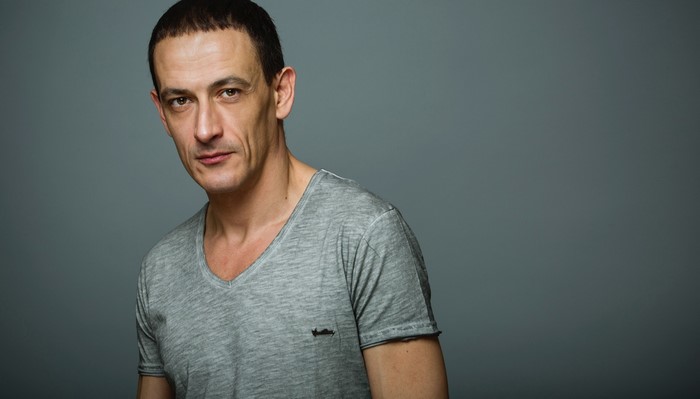 Portrait of actor Francisco Boira in grey t-shirt