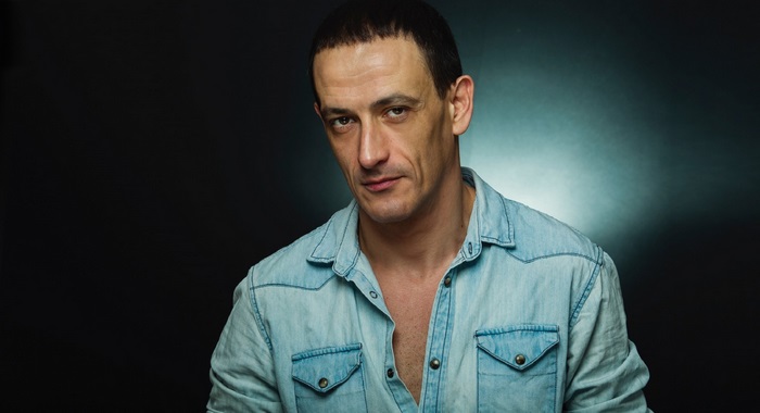Portrait of actor Francisco Boira in a denim shirt