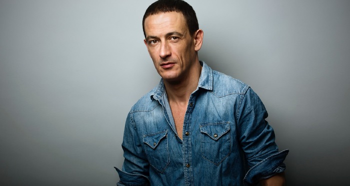 Portrait of actor Francisco Boira in a denim shirt