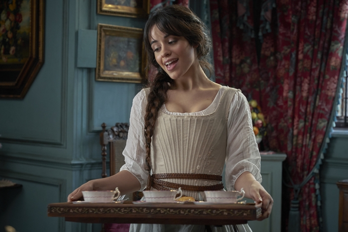 Camila Cabello as Cinderella holding a tea tray