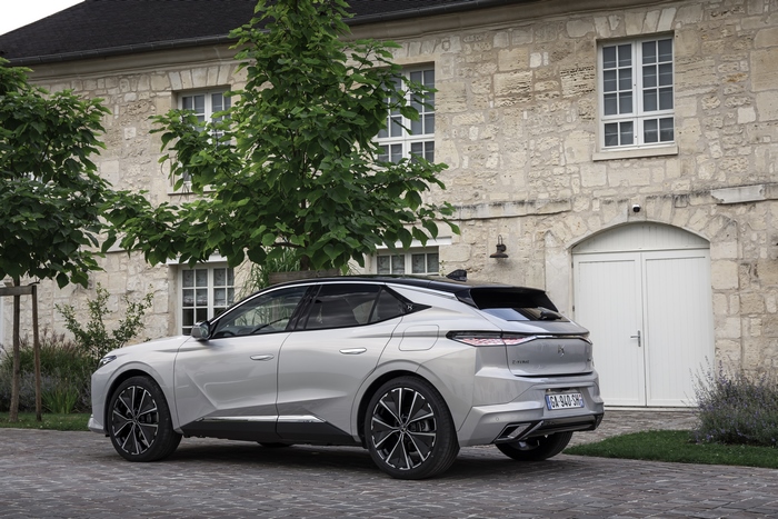 DS 4 E-Tense electric car parked at stone house