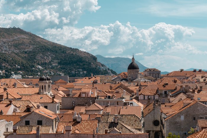 Dubrovnik, Croatia old town with red roofs and mountains