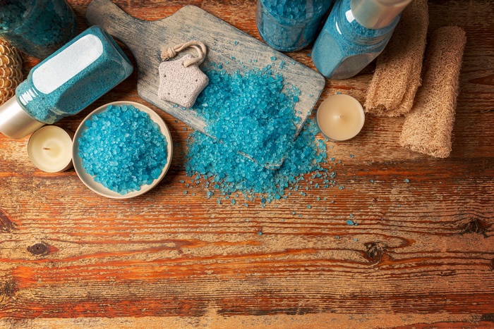 Spa still life with blue bath salts and candles
