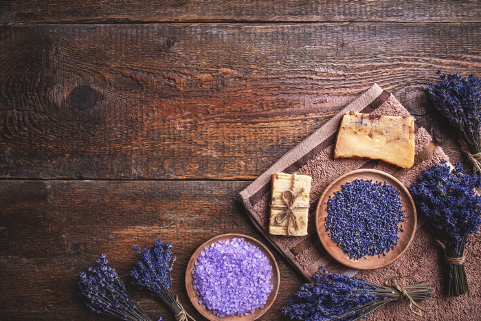 Natural lavender spa products on rustic wood