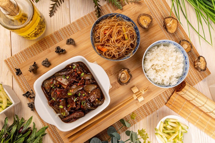 Asian Still Life Meal with Beef, Noodles, and Rice