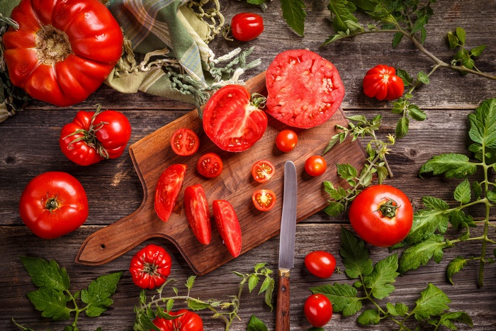 Fresh Tomatoes Still Life on Rustic Wood