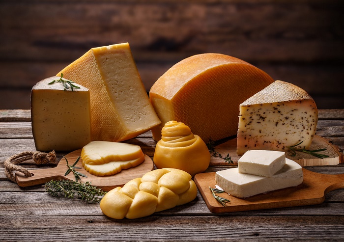 Assorted Cheese Still Life on Wooden Table