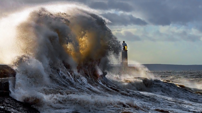 Massive Wave Crashing Against Lighthouse