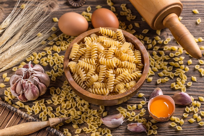 Pasta still life with eggs, garlic, and wheat