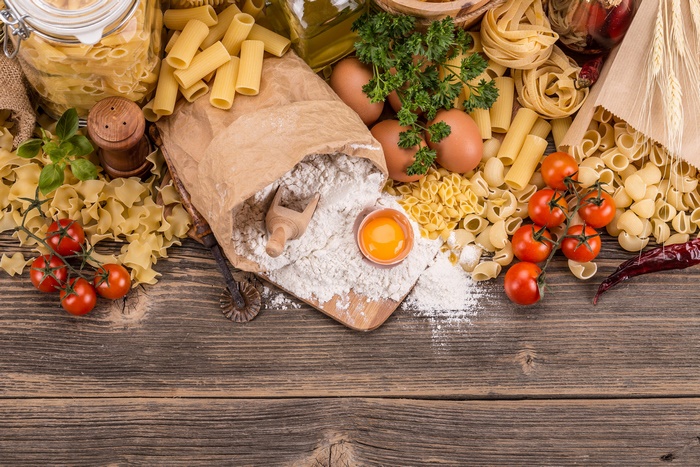 Pasta ingredients still life with tomatoes and flour