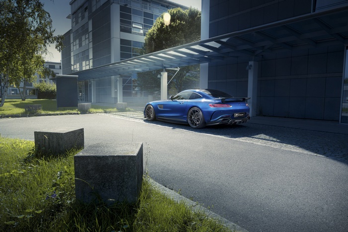 Blue Mercedes-AMG GT S parked at modern building